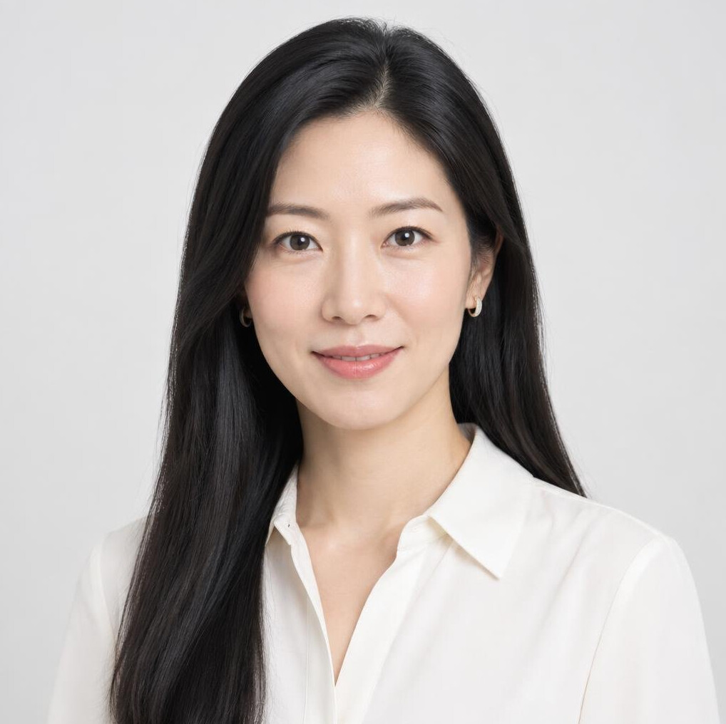 Studio headshot of an Asian woman business analyst