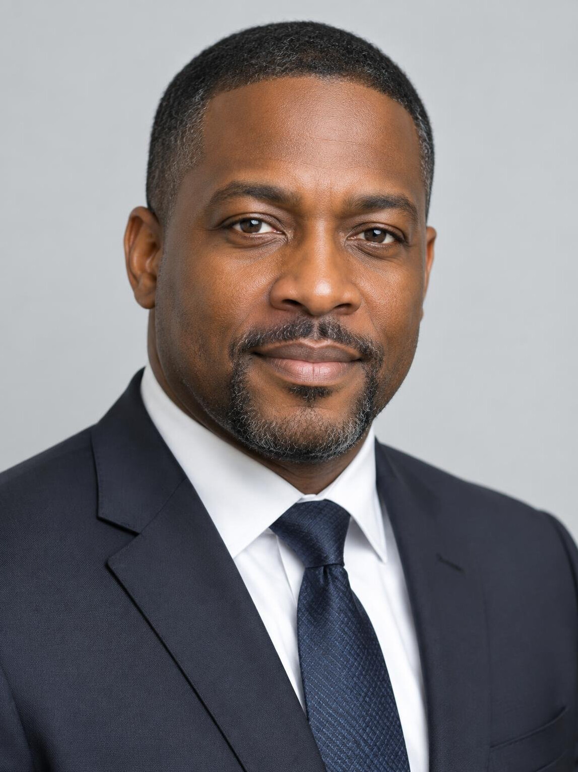 Portrait of a Black businessman in a suit looking at the camera