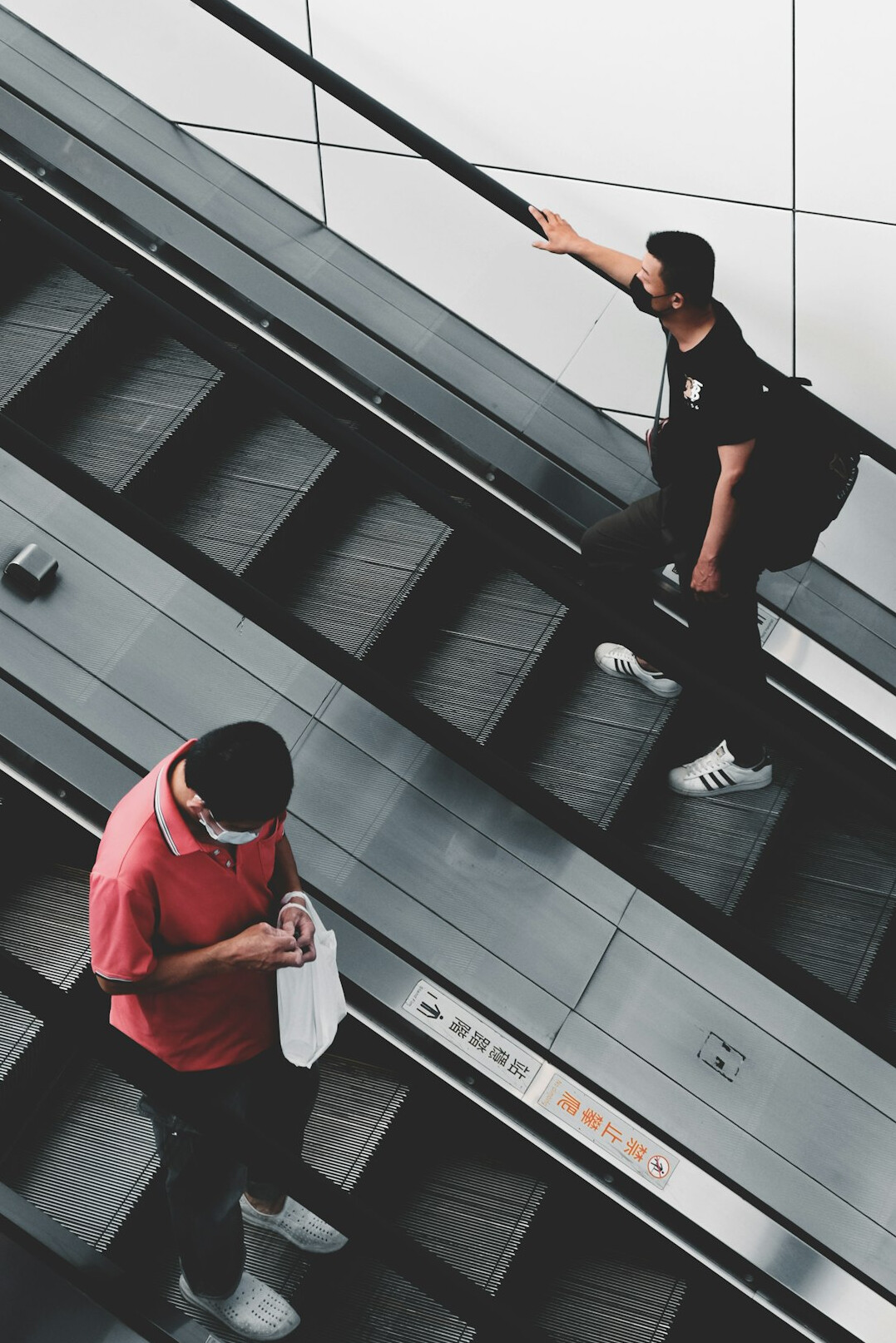Two colleagues discussing a compliance report at an office desk